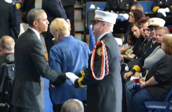 Villages Public Safety Capt. Kevin Ratzmann shakes President Obama's hand.