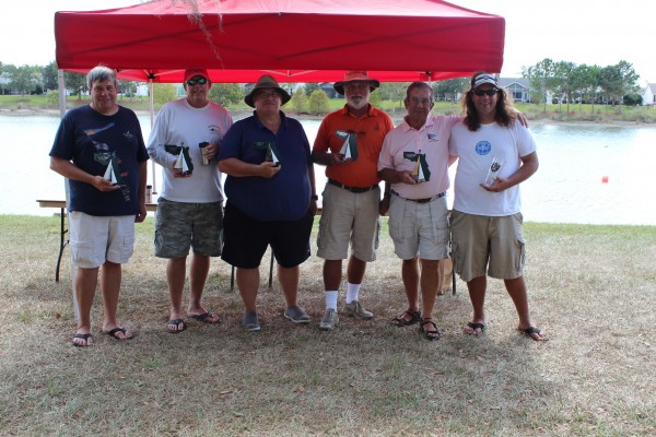 Trophy winners at the 2015 Gator Regatta were, from left, Race Director Ricky Gerry,  1t Place Alan Perkins, 2nd Place Jack Ward, 3rd Place Joe Walter, 4th Place Jon Luscomb and 5th Place Dave Linville. 