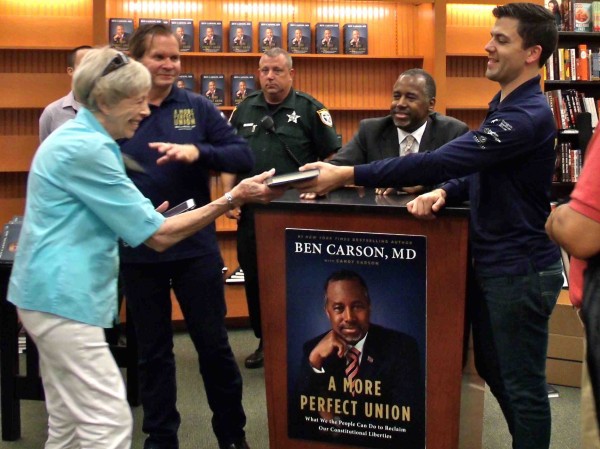 Ben Carson signed hundreds of books Monday before tour organizers had to shut down the line.