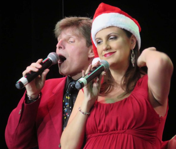 Clark Barrios and Mary Jo Vitale share a Christmas moment.