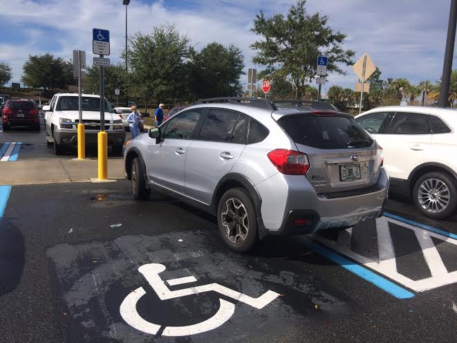 This vehicle was parked partially in a handicapped spot at Sam's Club.