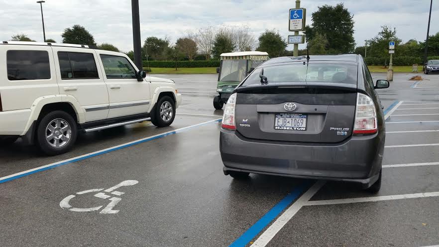 A Prius-driving New Yorker in a handicapped parking spot.