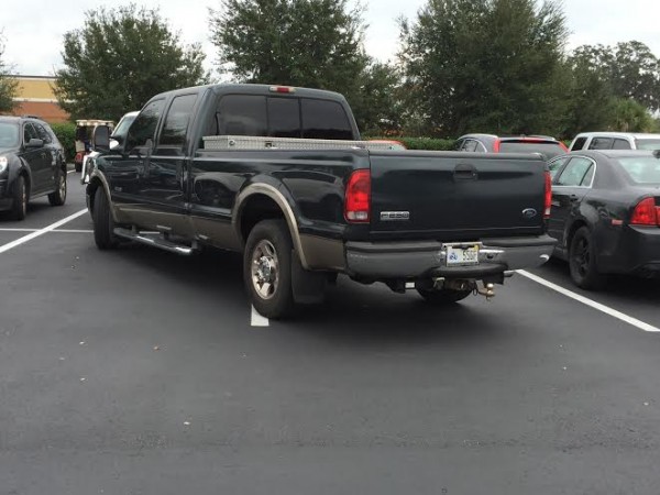 A truck takes up two spaces at HomeGoods.