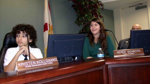 Esteban Suarez, left, and Micala McGrath took on the roles of town officials.