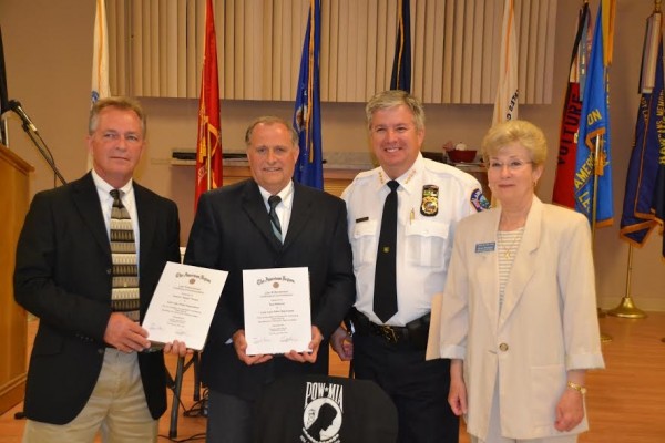 Stewart “Butch” Perdue, Ronald Michaud, Chief Chris McKinstry and Mayor Ruth Kussard, from left. The detectives were honored in 2014 for their work at American Legion Post 347.
