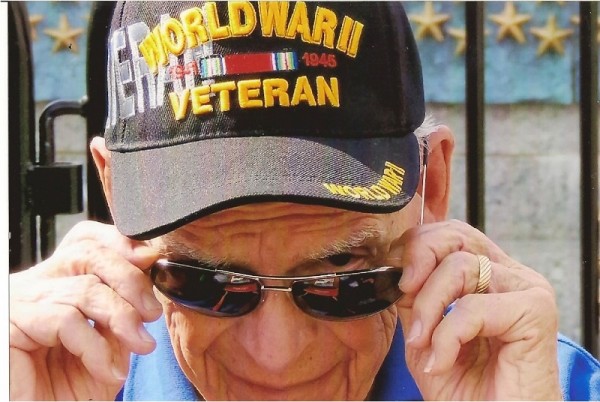 Wendell Adell wiping tears at the memorial.