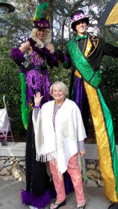Claudia Jones of the Village of Briar Meadow with the stiltwalkers.