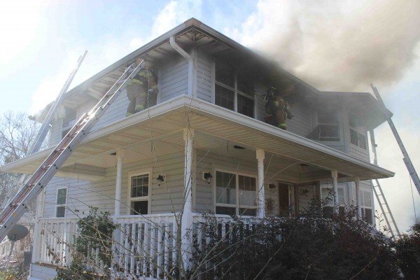 Firefighters rescue dogs from blaze at home in Summerfield. 