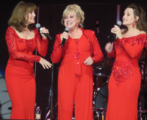 Kathy, left, sings with sisters Janet, center, and Mimi Lennon.