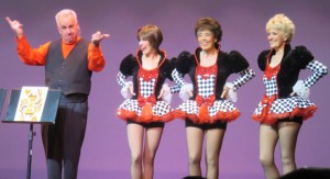Magician Wally Libenson gets some help from his dancing friends.