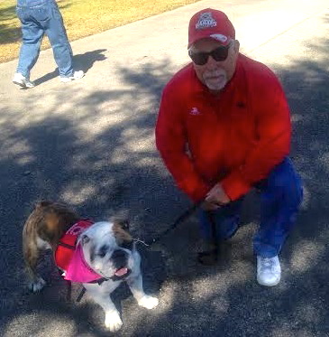 Stuart Feinberg of the Village of Pennecamp with his English Bulldog Maximus.