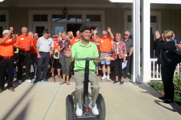 The crowd cheers as Joe Hertrich tries out his Segway.