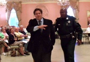 David Koller is escorted out the commission meeting.