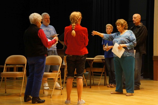 The cast of "The Curious Stranger" in rehearsal.