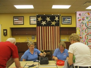 People bought tickets for the drawing of the donated quilt Stars and Stripes made by Ardie Wood.