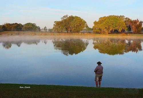 Villager Bill Shelton fishing at daybreak on Lake Miona pond