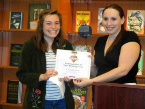 Cassie Mead, left, is presented a certificate by Heather Hooper.