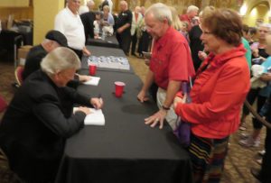 Bobby Rydell autographs his newlly-released biography for Villagers Barry and Lorraine Laidlaw.
