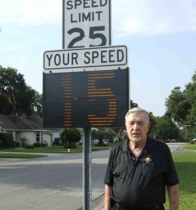 Carl Kusky with a speed sign on Chula Vista Avenue. Kusky has long championed greater speed enforcement. 