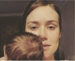 Megan Boone holds her new baby.