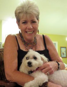Roni Crowder and Teddy Bear enjoy the singing show right at home.