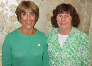 Sandi Madsen, left. and Mary Cochran catch their breath after performing with The Young Irelanders.