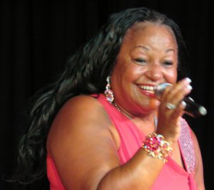 Toni Booker, a retired police officer in Detroit, singing with the Dorels.
