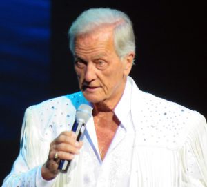 Pat Boone wore a white outfit at The Sharon.