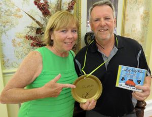Rickard Loscheider shows off his greaser olympics medal with Judy O'Brien.