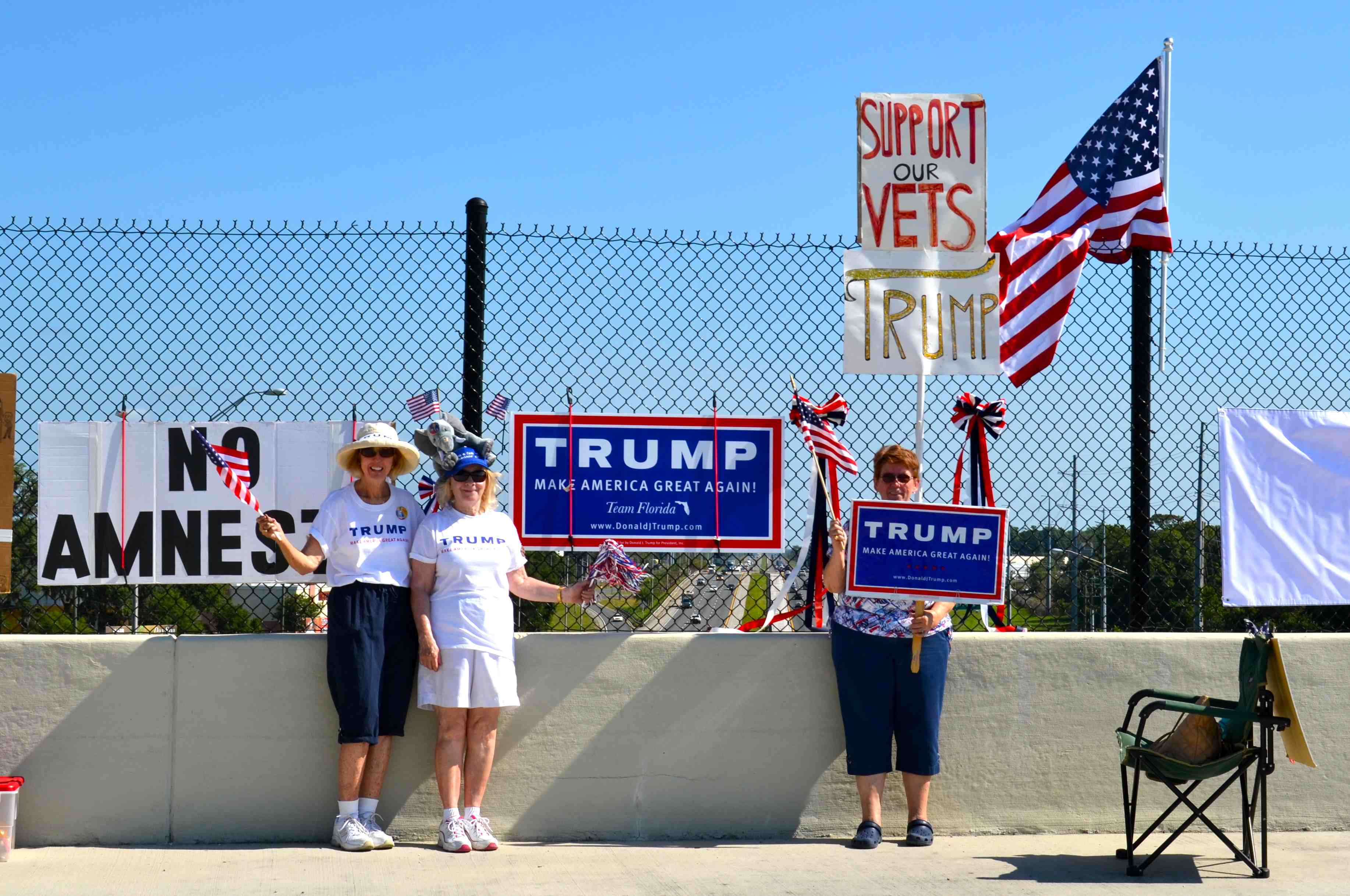 Sue Cianci, Donna McCartney, and Donna Hoak on the overpass at Interstate 75,