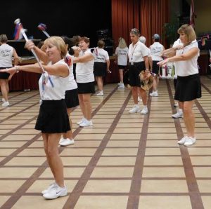Villages Twirlers Captain Ann Pelle, left, rehearses with the group.