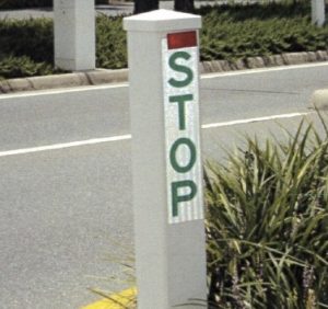 A white stick stop sign