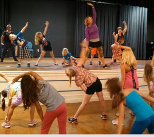Barb Matson leads the young ones in a Zumba warmup.
