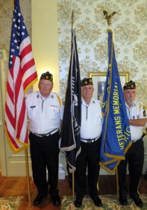 Bob Suelter, left, Larry Luebben and John Gibbons made up the Color Guard for Villages Bands holiday spectacular.