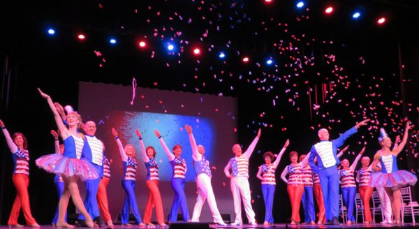 Diane Vargas, far right, and Evolution Dance celebrate the holiday in July 4th style at Savannah Center.