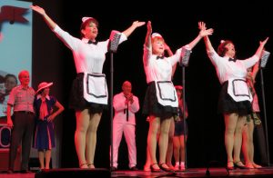 Kristin Miller, left, Sally Spieth and Lynne Greenberger singing at the USO.
