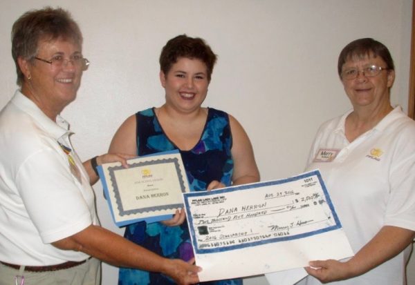 PFLAG president Peggy Garvin, left, and Merry Headman with scholarship recipient Dana Herron.