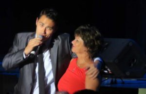 E. Michael Evans sings to Villager Debbie Johnson.