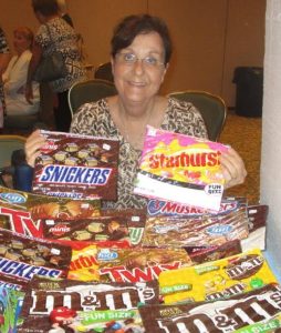 Laurel Manor chapter member Linda Semon fashions make-up bags out of candy bags.