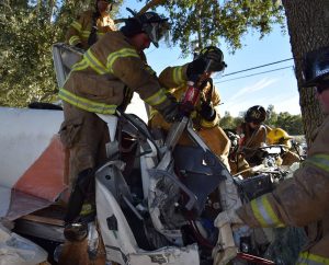 Marion County Fire Rescue works to extricate a driver from a truck that crashed into a tree.
