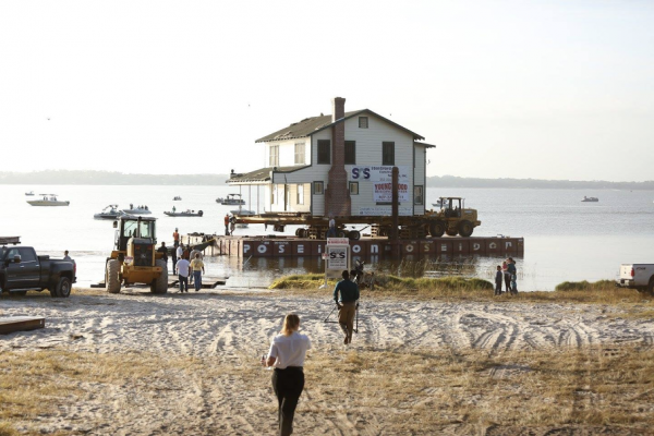 Ma Barker’s famed hideout was moved by barge Thursday across Lake Weir.