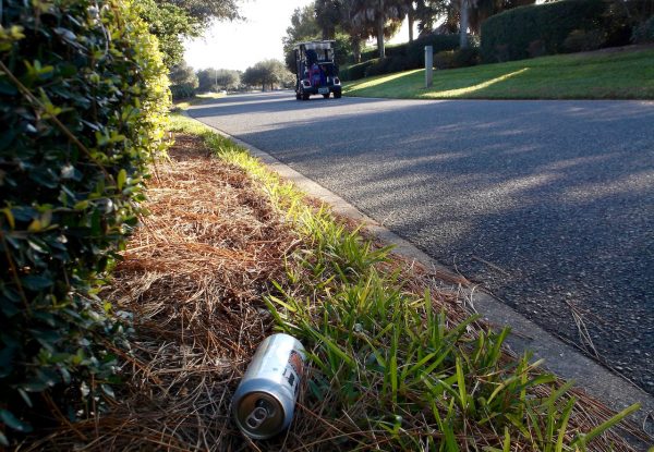 A Miller Lite can discarded along a multi-modal path in The Villages. 