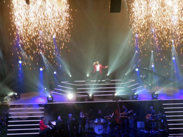 Pyrotechnics light up the stage and Fernando Varela belts out a song atop the stage.