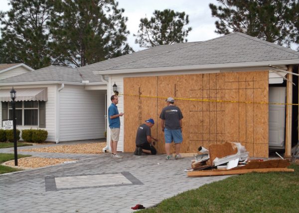A crew was making an emergency repair to the home on Woodridge Drive.