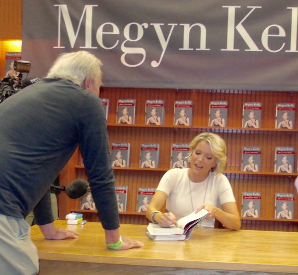 Megyn Kelly autographs a book at Barnes & Noble.