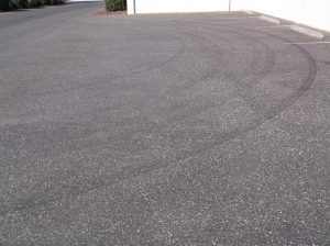 Tread marks on the surface at the supplemental parking at the Hillcrest Villas.