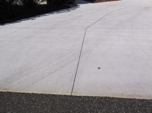 Treadmarks are visible on a driveway in the Hillcrest Villas.