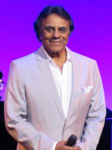 Johnny Mathis flashes a smile Thursday night on stage at The Sharon.