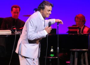 Johnny Mathis leans into a song on Thursday.