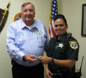 Sheriff Bill Farmer with Deputy Beatrice Ayala in 2012.